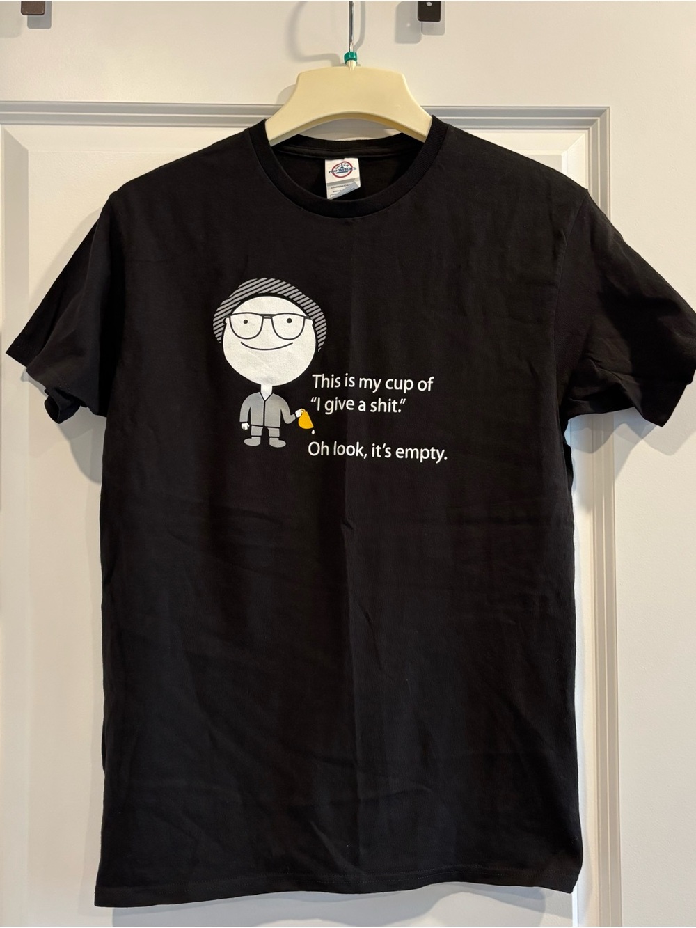 This is my cup of “I give a ****.” Oh look, it’s empty. Men’s medium.